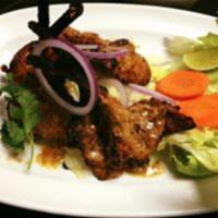 Lamb Chops · Lamb chops marinated in yogurt, blended with ginger, garlic, herbs and spices then grilled i...
