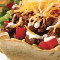 Taco Salad · A crispy flour tortilla with chicken or ground beef, beans, lettuce, tomatoes, cheese and so...