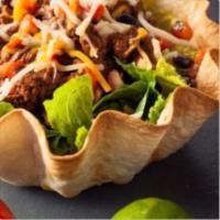 Fajita Taco Salad · A crispy flour tortilla bowl, filled with grilled chicken or steak, grilled peppers, onions....