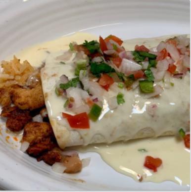Burrito Chullin · A large burrito filled with grilled chicken, chorizo, rice and beans. Topped with cheese sauce and pico.