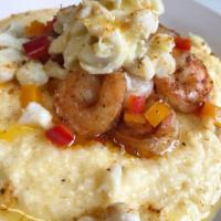 Shrimp and Grits · Cajun sauteed shrimp with hot sausage over cheese grits.