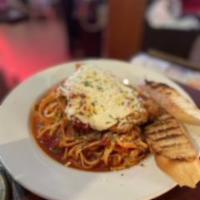 Chicken Parmesan  Pasta · Deep fried chicken breast topped with marinara sauce and mozzarella cheese. served over fett...