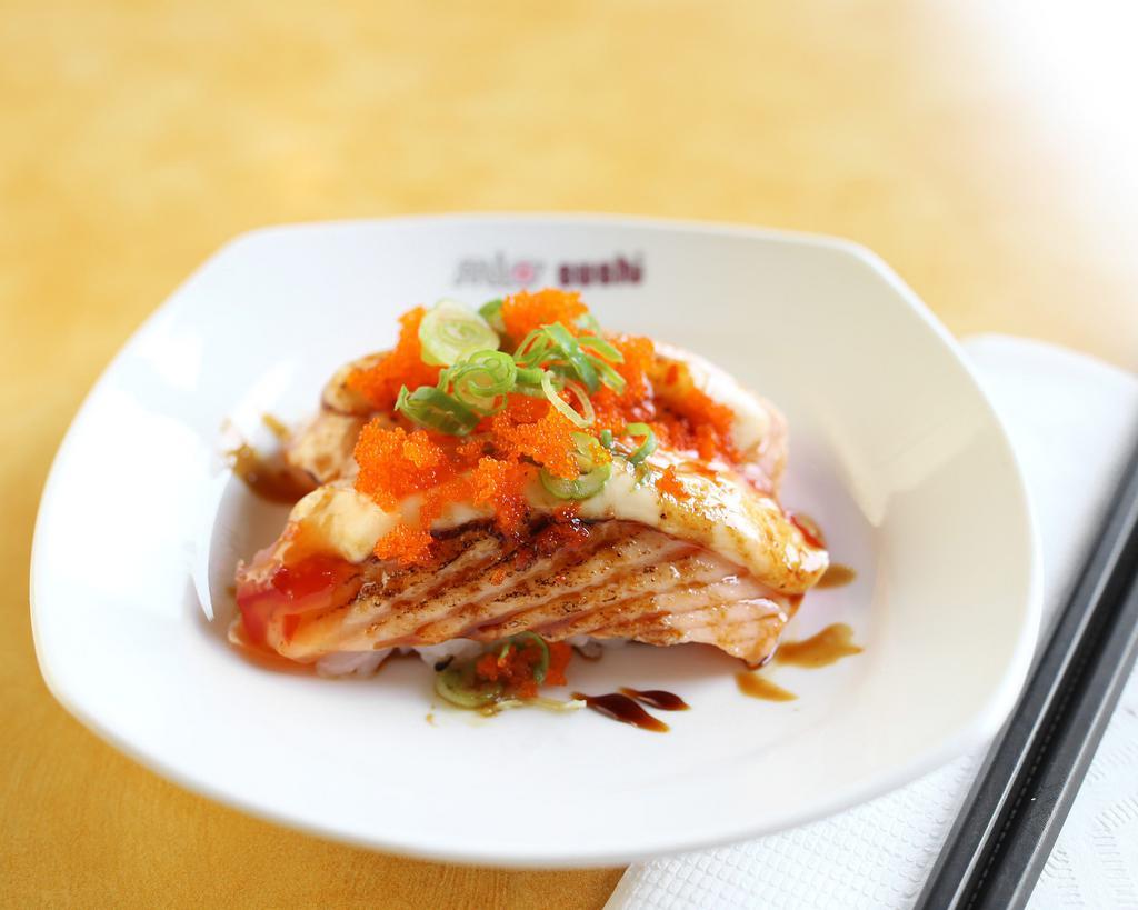 Seared Sweet Salmon Nigiri · Slightly seared. Spicy mayo, sweet chili sauce, unagi sauce, green onion, masago, sesame seed.