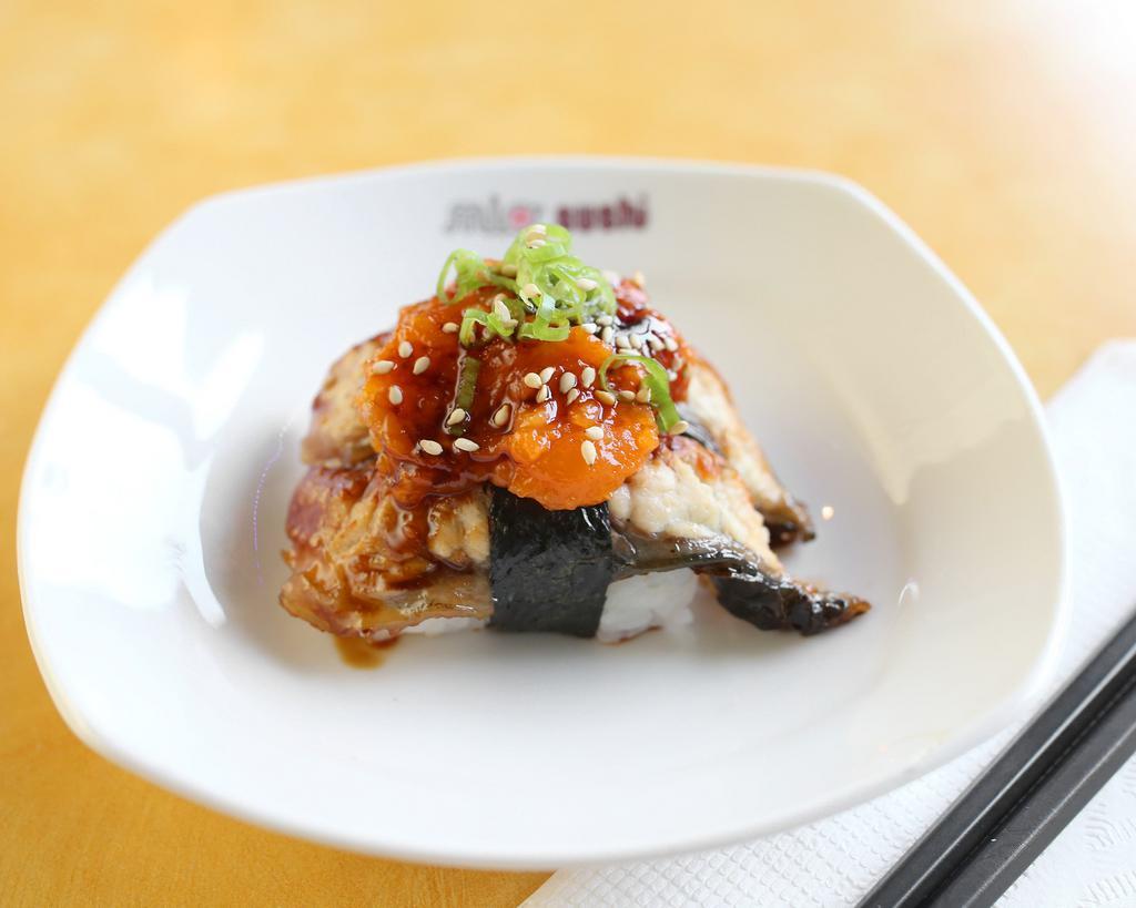 Spicy Salmon on Top of Unagi Nigiri · Fresh water eel with spice salmon.