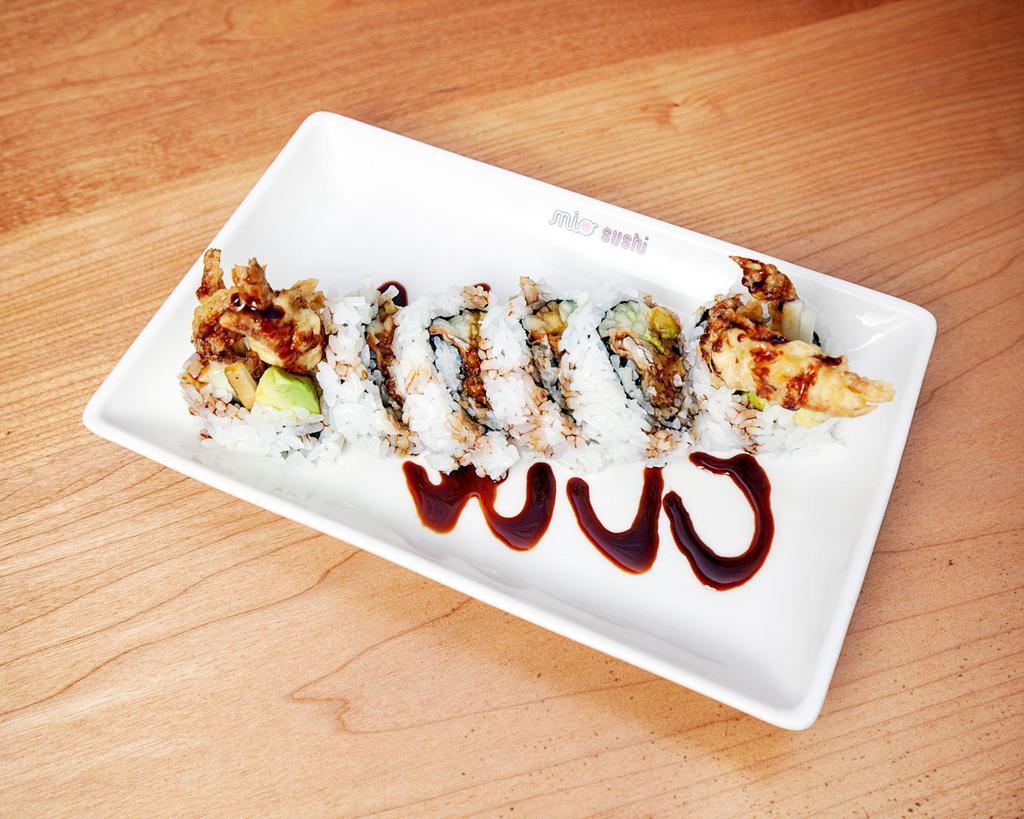 Spider Roll · Deep fried soft shell crab, cucumber, avocado, sesame seed and sweet sauce. Cooked.