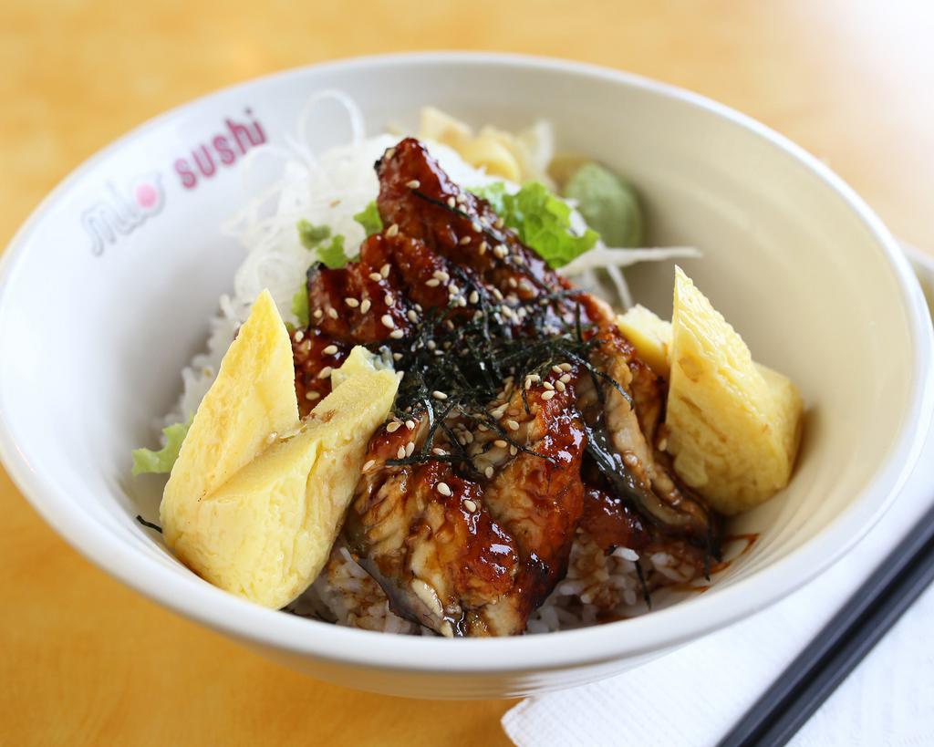 Unagi Donburi · 8 pieces unagi, sweet sauce, and tamago. Served on a bed of steamed rice.