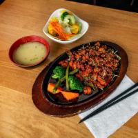 Spicy Chicken · Hot. Stir-fried chicken, onion, red and green pepper, steamed vegetables, sweet hot sauce an...