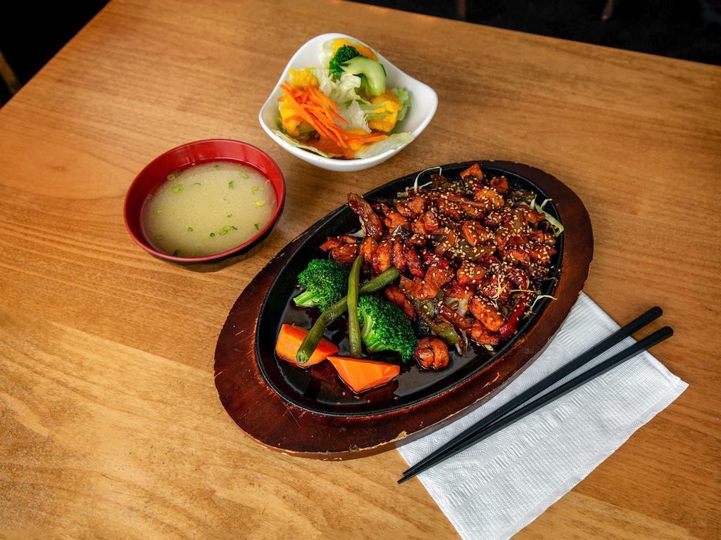 Spicy Chicken · Stir fried chicken, onion, red and green pepper, steamed vegetables, sweet hot sauce, and sesame seed. Served with small Mio salad.