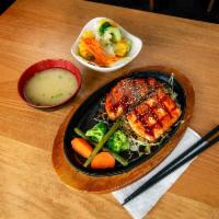 Salmon Teriyaki · Grilled salmon, teriyaki sauce, steamed vegetables and sesame seed. Served with small mio sa...