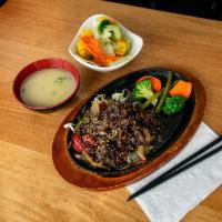 Beef Yakiniku · Sweet Korean marinated BBQ beef, steamed vegetables, onion, red and green pepper, and sesame...