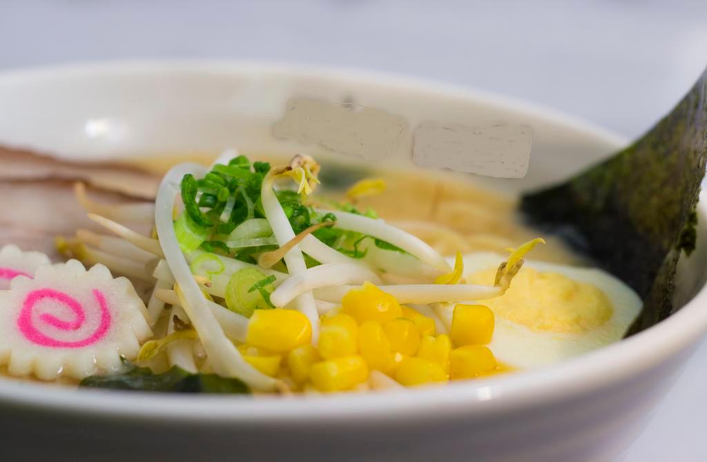 Sappo Ramen · Fresh noodles, miso sauce base broth, pork chashu, naruto, 1/2-cut egg, bean sprout, green onion, and seaweed.