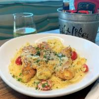 Pan Seared Chicken Pasta · Pan-seared, panko-breaded chicken with a lemon-caper butter sauce. Served with fettuccine, a...