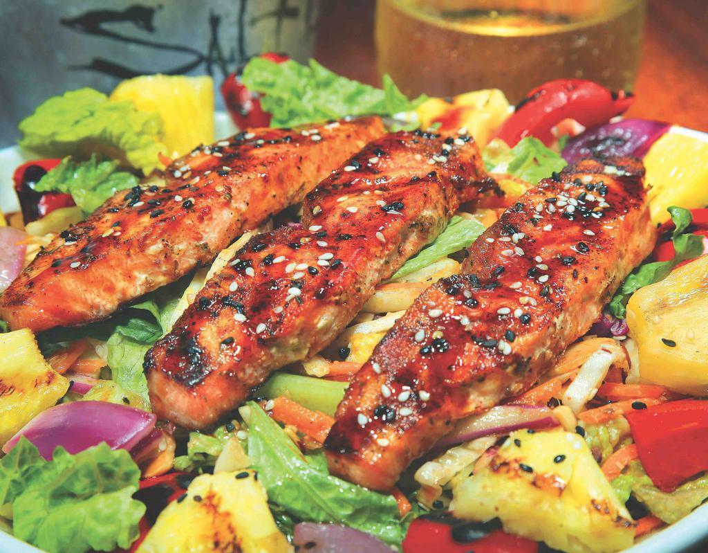 Asian Salmon Salad · Grilled salmon over mixed greens with carrots and cabbage tossed in a ginger dressing topped with fire roasted red peppers, red onion, grilled pineapple chunks, sliced almonds, green onions and drizzled with a sweet Asian sauce. (Contains Almonds)
