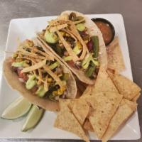 Vegan Tacos · 2 corn tortilla tacos filled with rice, cabbage, red and green peppers, fire roasted corn an...