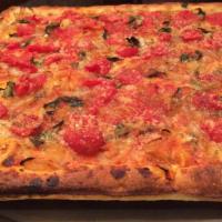 Sfingione Pie · Authentic crunchy Sicilian crust topped with plum tomatoes, sauteed onions, and anchovies (o...