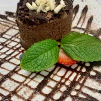 Chocolate Mousse Cake · Chocolate ganache. Served with chocolate sauce and berries.