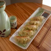 Gyoza · Pan fried dumpling. Chicken or vegetarian with sesame vinaigrette dipping sauce.