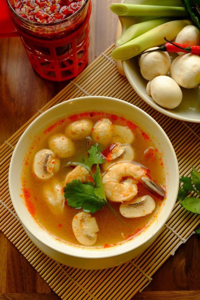 Tom Yum Soup · Hot and sour lemongrass soup with mushrooms. Mild spicy.