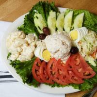 Smoked Whitefish Salad Platter · Smoked whitefish salad served with lettuce, beefsteak tomato, potato salad, coleslaw and sli...