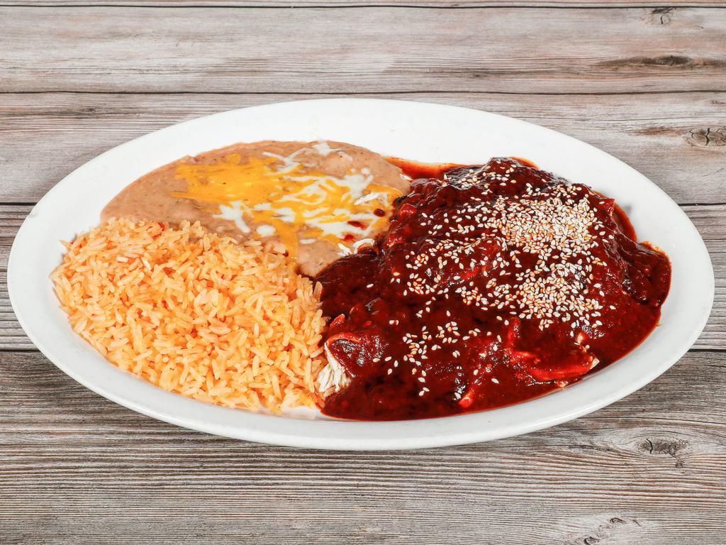 Chicken Mole Poblano · Made with red chiles, chocolate, and spices.