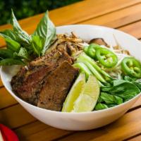 Smoked Brisket Pho · Traditional noodle soup served with 14 hours smoked brisket, rice noodles, shiitake mushroom...