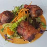 DATES · Stuffed with goat cheese, Spanish sausage, wrapped with pancetta and sweet chili aioli.
