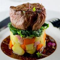 FILET MIGNON · Served over tri-color potatoes, sautéed spinach and blue cheese sauce