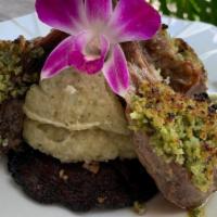 RACK OF LAMB · With a mint chimichurri crust served with green mashed potatoes over grilled Portobello