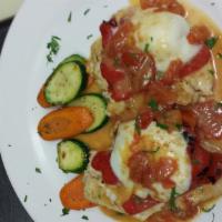 Pollo Cardinale · Roasted peppers, mozzarella and diced tomatoes over the breast of chicken.