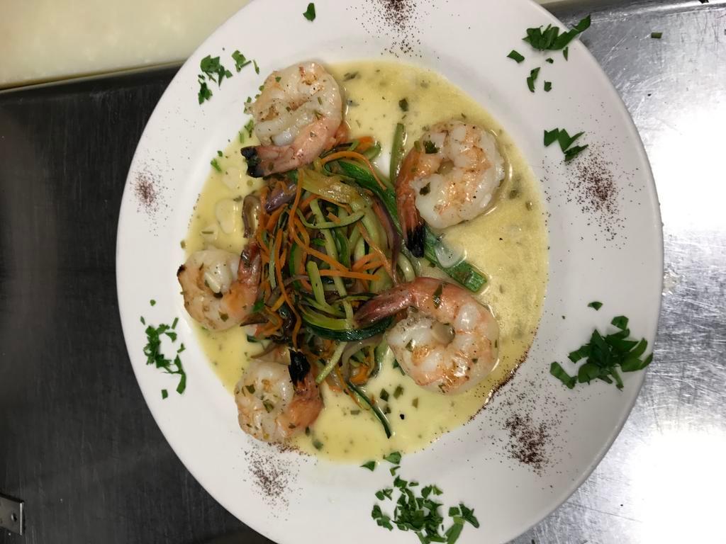 Gamberoni alla Griglia · Seasoned grilled shrimp over mixed vegetables with a white wine lemon sauce.
