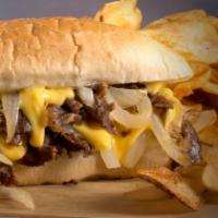 Cheesesteak · It's not just for Philly anymore. Melted American cheese topping shaved steak, accompanied b...