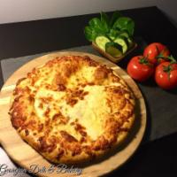 Megruli Khachapuri · Cheese melted inside dough, baked with extra cheese on top. Vegetarian.