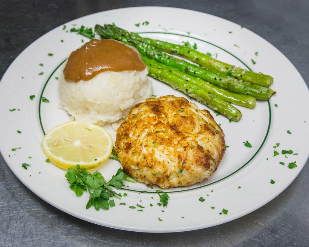 Maryland Crab Cake · Fried or broiled 5 oz. flavorful Maryland-style jumbo lump crab cake and tartar sauce.