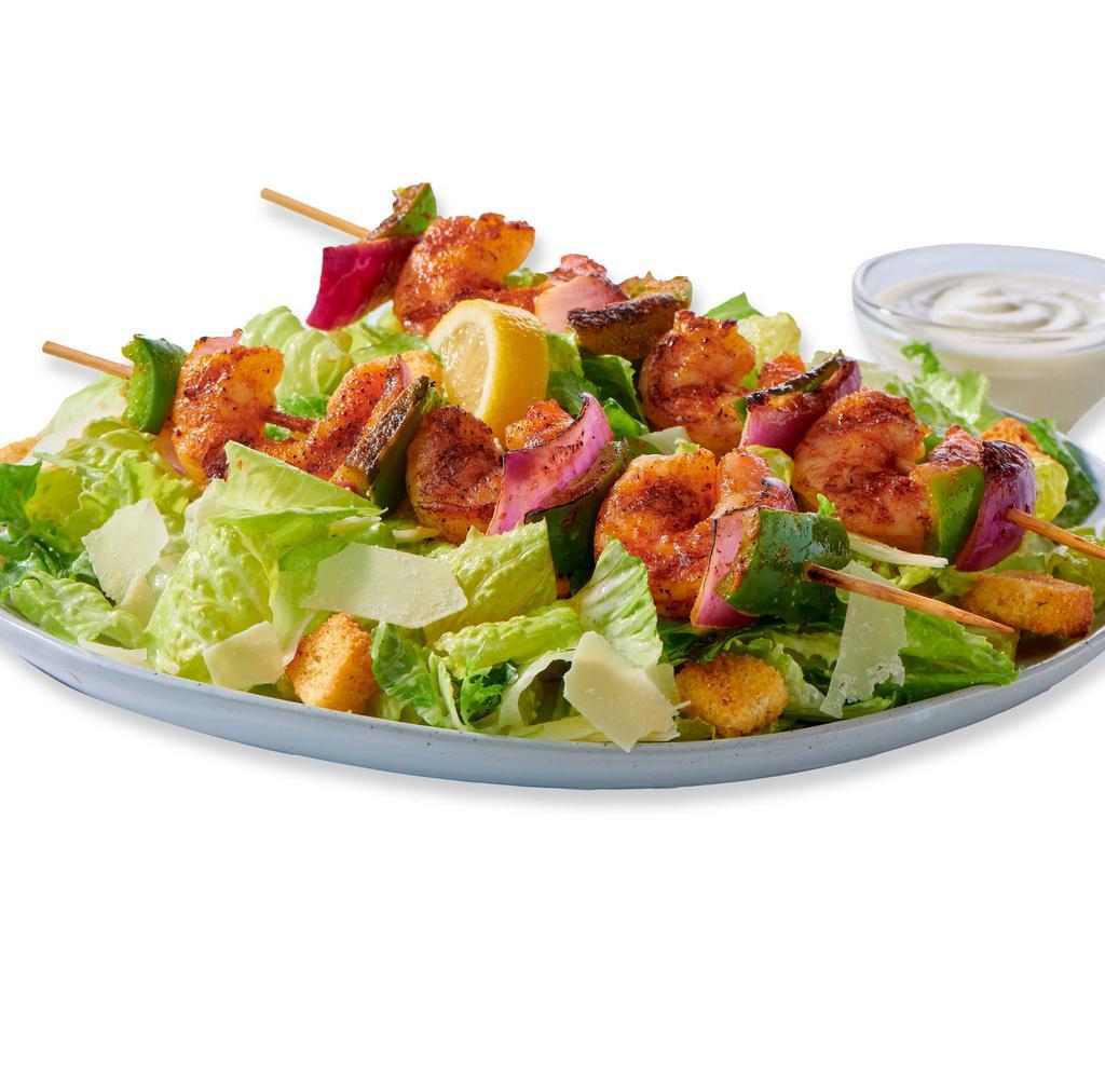 Caesar Salad with Grilled Shrimp Kebob · Caesar Salad topped with Shrimp Kebobs