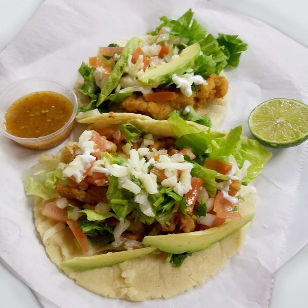 Fish Taco · 2 pieces. Fish taco served on corn tortilla served with choice of meat, beans, lettuce, cheese, crema, pico de gallo and sliced avocado.