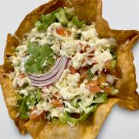 Taco Salad · Choice of Meat. Served on a fried flour tortilla shell, layered in beans, rice, lettuce, che...