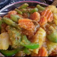 Mixed Vegetable Curry · Assorted vegetables prepared in garlic ginger homemade  brown sauce. Served with basmati ric...