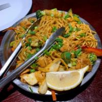 Chicken Chow Mein · Noodles stir fried in a wok with vegetables and chicken