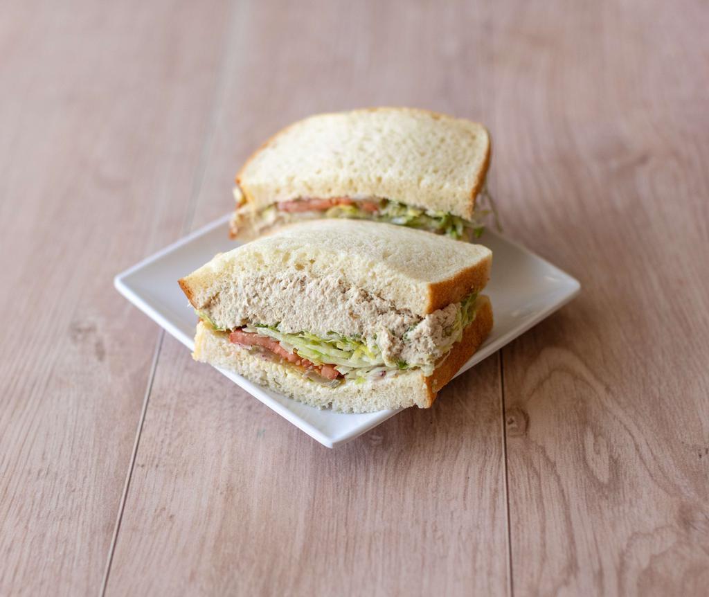 06. Tuna Salad Sandwich · Includes: mustard, mayo, lettuce, tomato, pickles, and onions