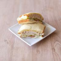 14. Deli Turkey Sandwich · Includes: mustard, mayo, lettuce, tomato, pickles, and onions