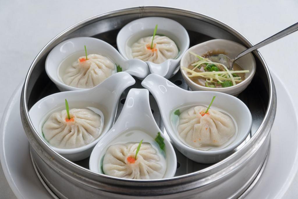 4.  Soup Dumplings (6 ) · Classic dim sum infused with chicken broth on the inside. Comes with 6 dumplings