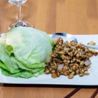 18. Chicken with Lettuce Wraps · Minced chicken seasoned with hoisin sauce, onions, and scallions. Served with four pieces of...