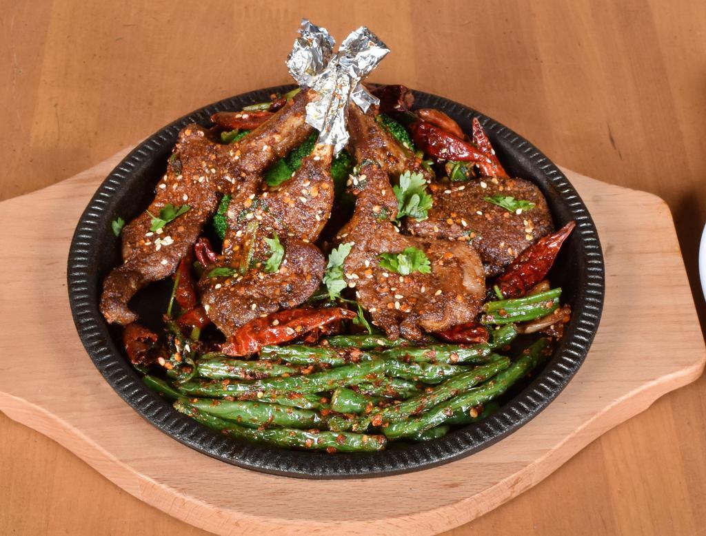 36. Cumin Lamb Chop · Four tender lamb chops marinated and seasoned with Szechuan spices and cumin. Served with string beans