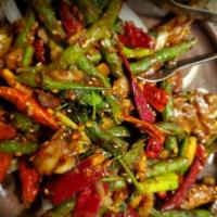 68. Dry-Fried String Bean · String beans stir-fried and seasoned in Szechuan spices