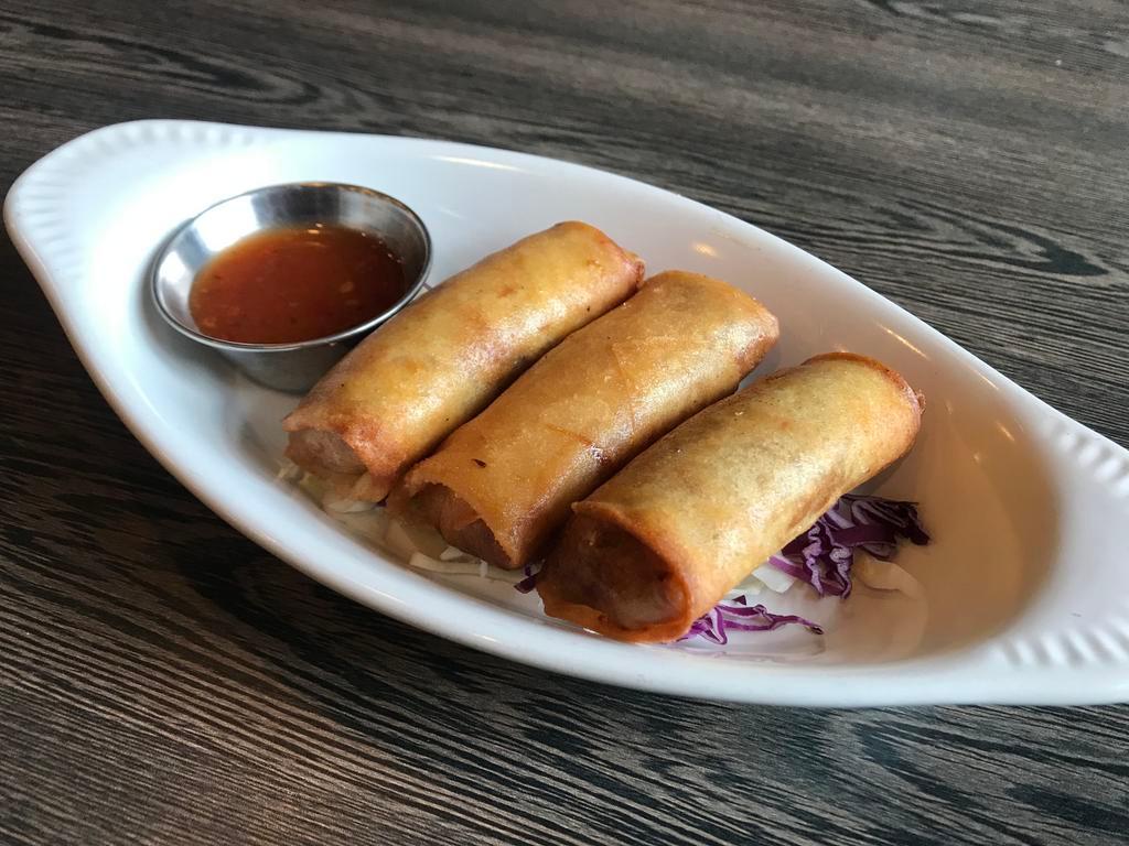 Thai Spring Roll · Hand-roll with cabbage, silk noodles, carrot and Thai sweet chili dipping sauce.