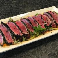 Tuna Tataki · Seared tuna, mixed greens and spicy goma sauce.