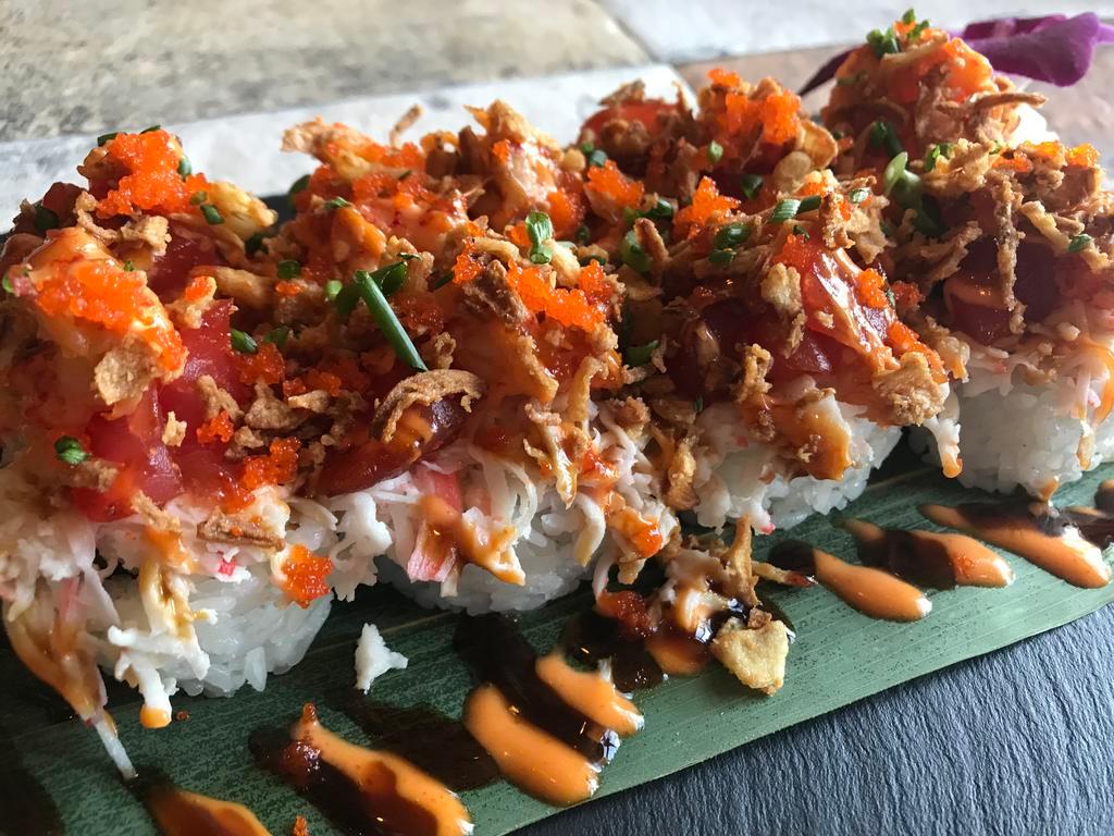 The Great Wall Roll · Inside: Tempura shrimp, jalapeno. Outside: Crawfish, spicy tuna, crab mix, fried onion, scallion, masago, eel sauce, spicy mayo, ponzu sauce.