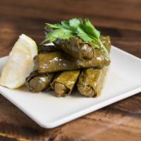 Dolmades · Six Stuffed Grape Leaves with Rice and Fresh Herbs. Served Chilled