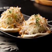 Pork Bun (2pc) · Marinated Pork, Bun, White onions, Hot sauce, Spicy mayo, Cabbage