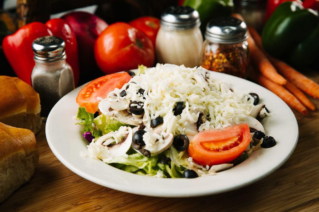 Antipasto Salad · Ham, salami, provolone, mozzarella, tomato, and olives on romaine lettuce. Served with bread.
